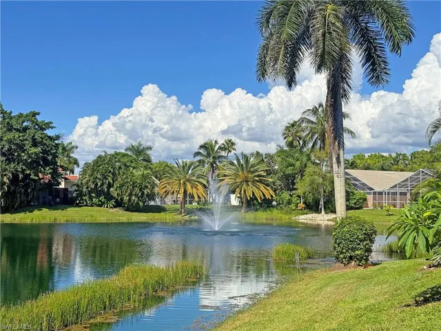 Long lake view with water fountain