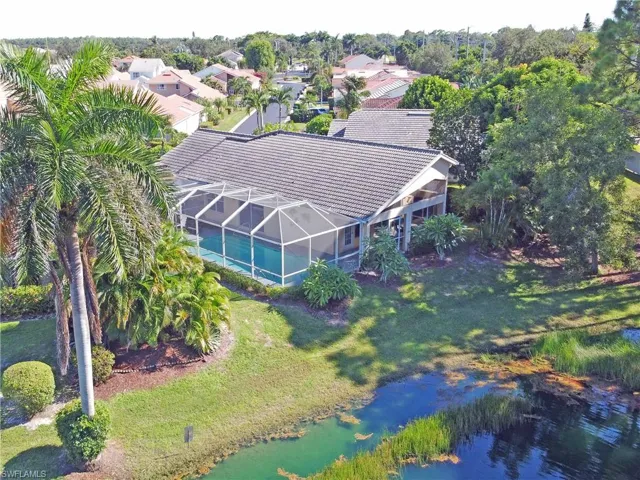 Aerial view of property's location featuring nearby suburban area