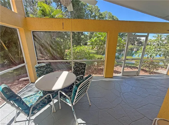 Sunroom / solarium with a water view