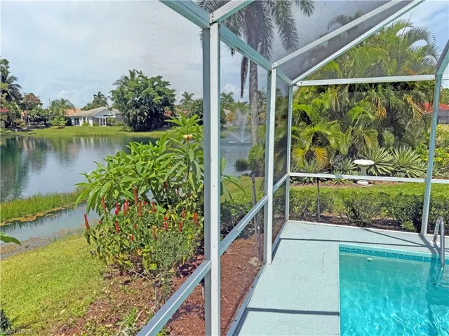 Unfurnished sunroom featuring a water view