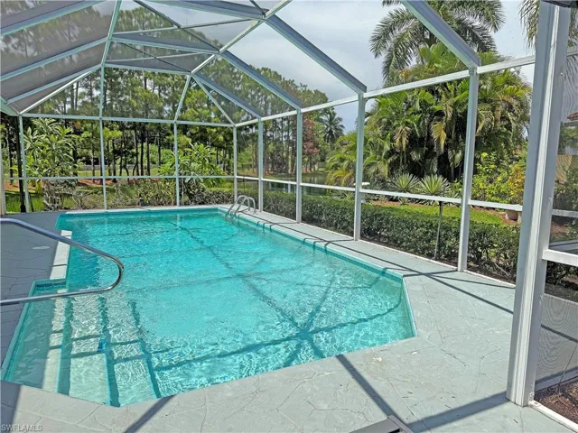 Outdoor pool with a lanai, a patio area, and a sunroom