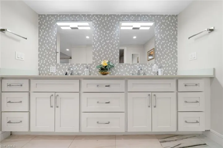 Bathroom with vanity and tile patterned flooring