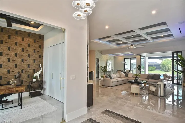 Lobby featuring coffered ceiling, beamed ceiling, and recessed lighting