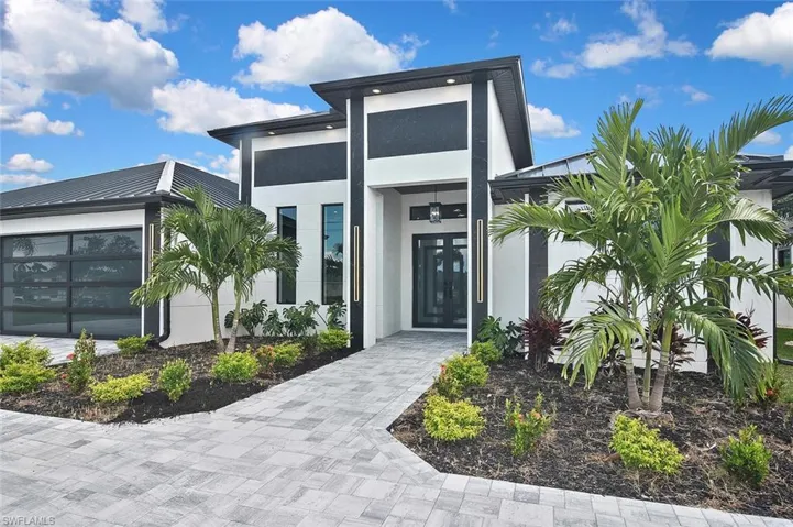 Entrance to property featuring stucco siding