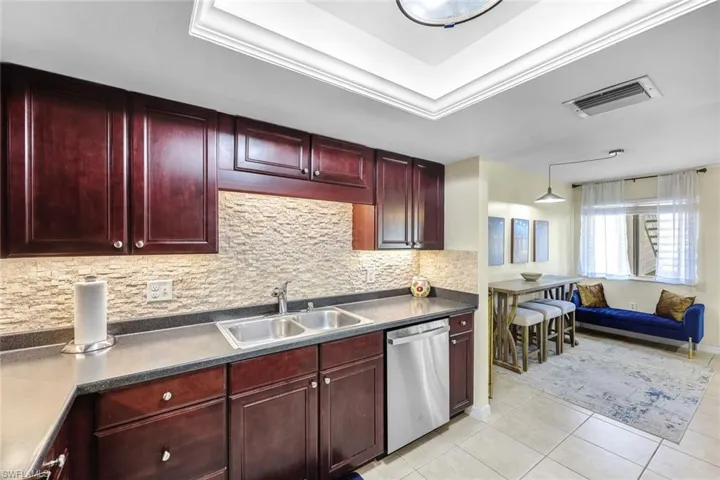 Kitchen is located right off the dining area, offering a seamless transition between the two spaces.
