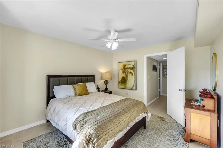 The primary bedroom is thoughtfully located on the opposite side of the condo, offering added privacy and a peaceful retreat from the main living areas.