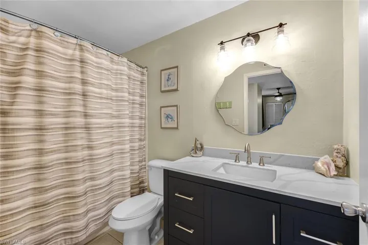 En-suite bathroom with a luxurious soaking tub and shower, providing the perfect space for relaxation and comfort.