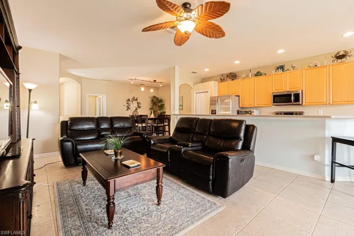 Tiled living room with ceiling fan
