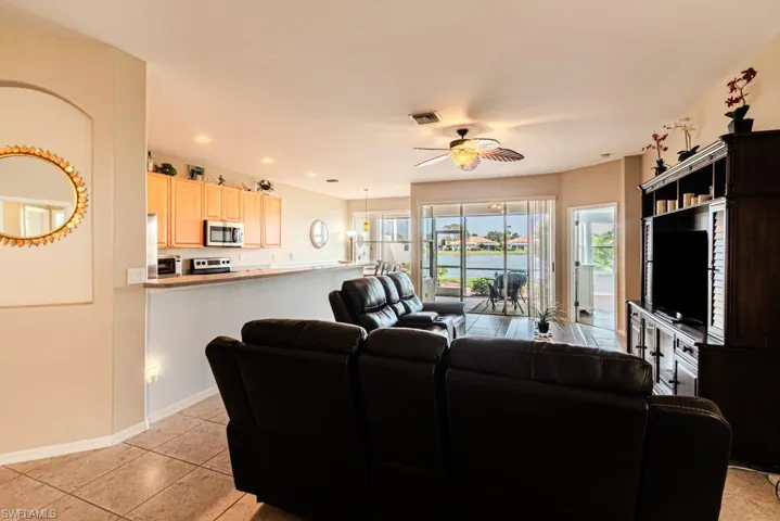 Tiled living room with ceiling fan