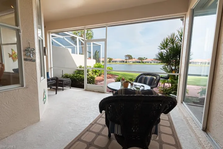 Sunroom with a water view