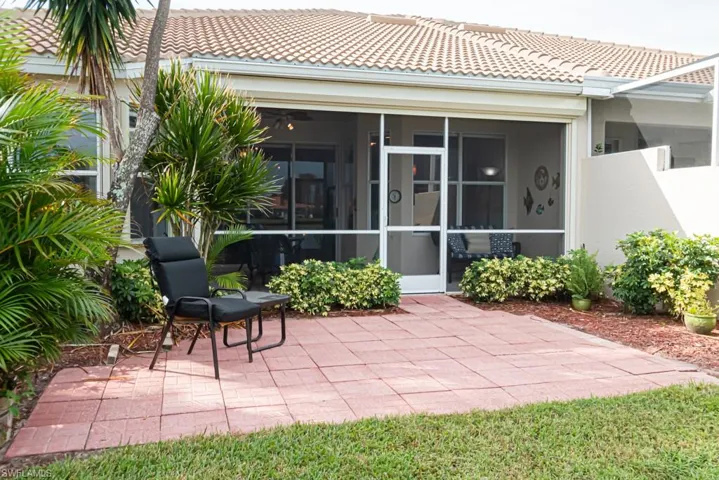 View of patio / terrace featuring a sunroom
