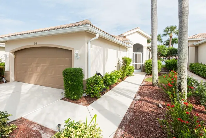 Mediterranean / spanish-style home with a garage