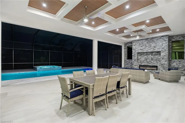 Summer kitchen, and covered lounge area with fireplace—perfect for gatherings or relaxed al fresco dining