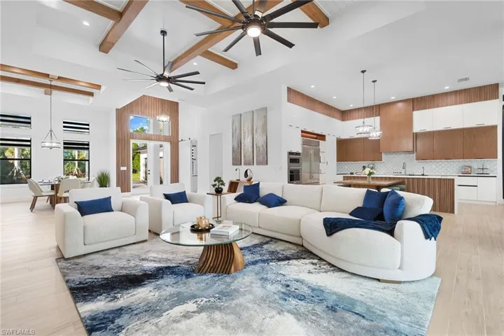 Thoughtfully curated—wood-look tile flooring and soaring ceilings with rich custom wood beams