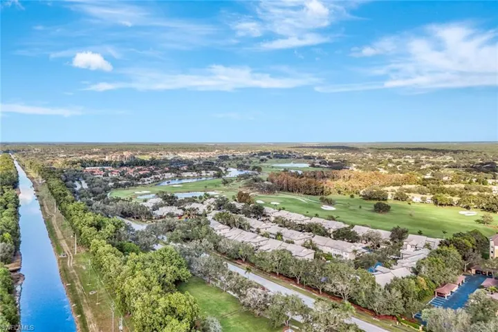 Aerial view of a nearby body of water and a golf course