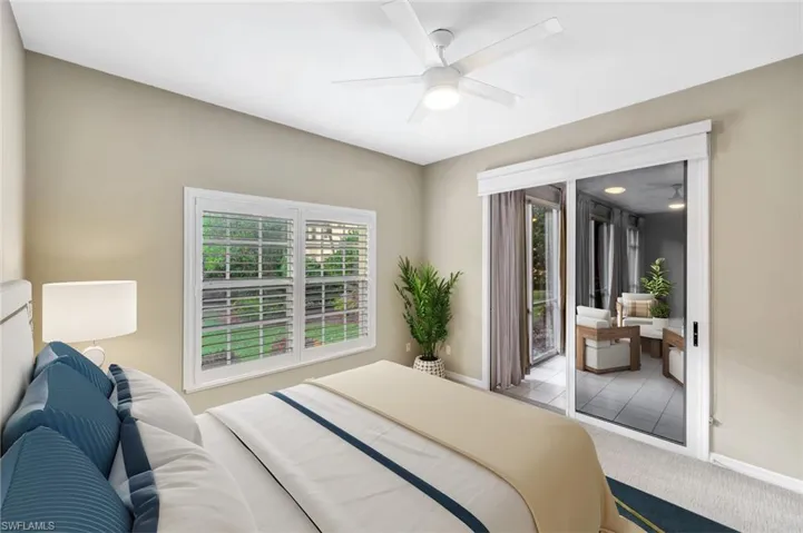 Virtually staged Bedroom with access to outside, a ceiling fan, and carpet