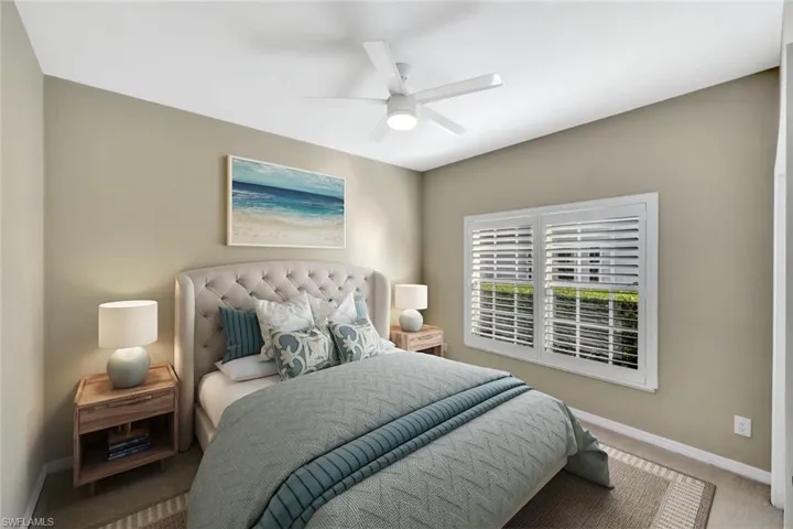 virtually staged Bedroom featuring carpet flooring and a ceiling fan
