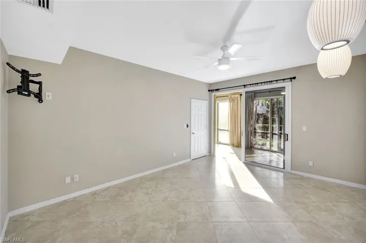Primary bedroom with baseboards and ceiling fan