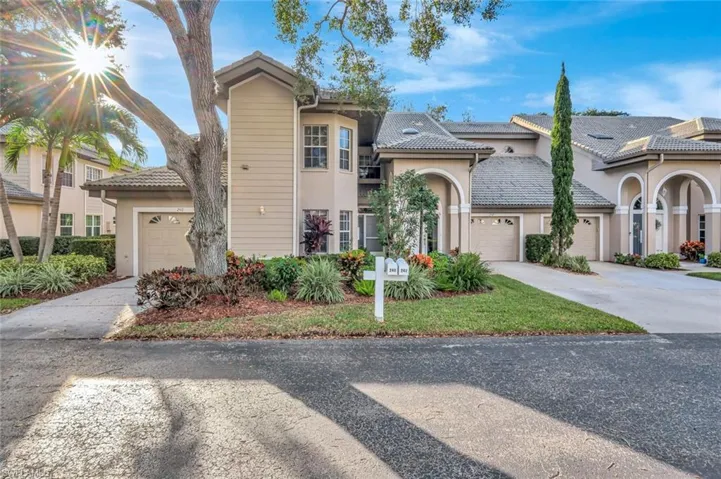 Mediterranean / spanish house with stucco siding, driveway, and a garage