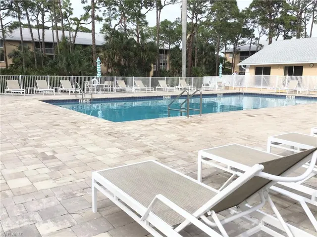 Community pool featuring a patio area
