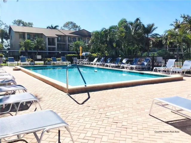 Community pool featuring a patio