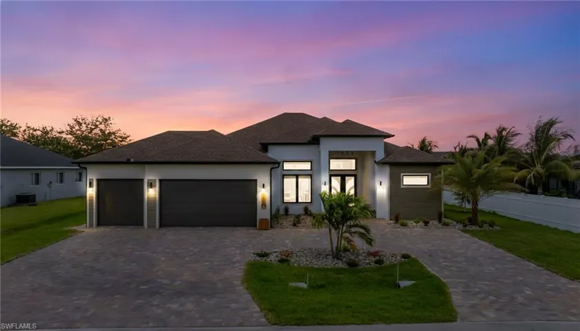 There's more lights! The Soffit lighting, the landscape lighting, the up lighting in the pavers. CIRCULAR Driveway! Come see this home! It's a CUSTOM MUST SEE!