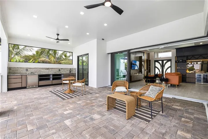 Bring the inside out or the Outside in... These Disappearing 90 degree Corner sliders are amazing! This space is a Must See! Oh, And it's all Screened it for Year Round Enjoyment!!