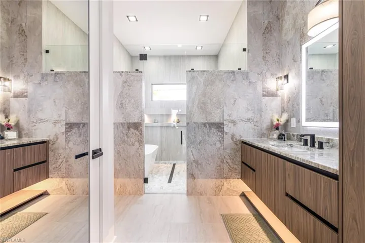 What??????? Am I in a high end resort here? This bathroom is Stunning! Custom textured Tiled walls?? Floating vanities with LED Lights! Custom lighted mirrors with anti fog! Wow there's a Lot of light in here! and the Glass entry into the WET Room! this is a MUST SEE!!!!!!