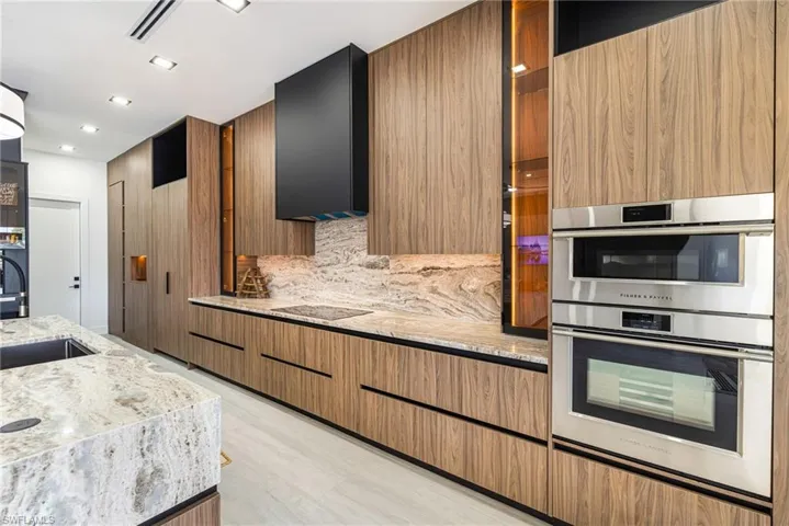 Custom High End Upgraded appliances. Convection cooking, oversized Cooktop, Hidden Hood Exhaust and hidden special features are a Must SEE!