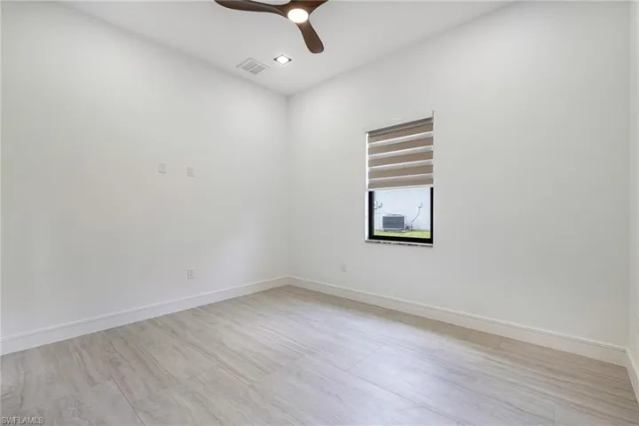 Look how spacious with ceiling fans on remotes and the ceilings are high!