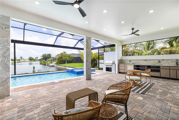 This Under truss Lanai area is So spacious! Those columns! This is an OASIS! Wait till you see this Pool Area.