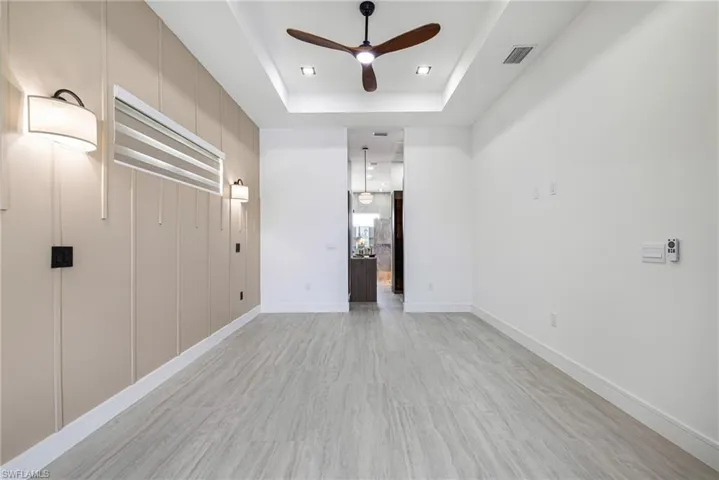 Oh this PRIMARY!!!!!!!!! Look at this Feature wall. Tray ceiling with Light Filtering Custom shades, Large Ceiling fan with remote, switches for your reading lights and wall outlets for charging!