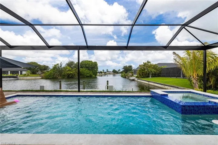 Ok, Now this is a View! Picture Views with a Spill over spa and Sun shelf. This is a Custom Pool. And it has a Table to allow you to enjoy a beverage! IN THE POOL!!!!!!!