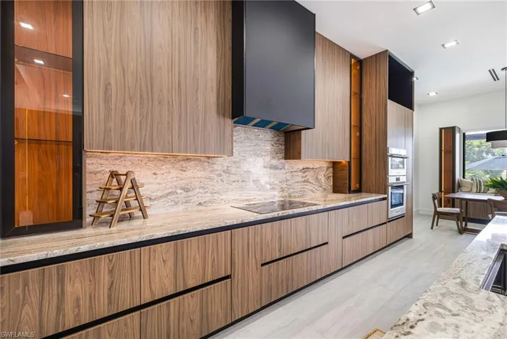 The Granite.. Oh is So beautiful and it runs up the backsplash. Easy Cleaning.