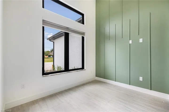 Flex Room. Den/Office/Theatre Room/4th Bedroom. Yes any of these options because this is a 4 bedroom house. Custom Light filtering Shades, Custom shelving and Feature wall.
