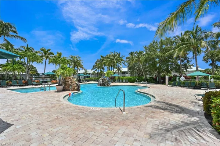 Community pool with a patio area