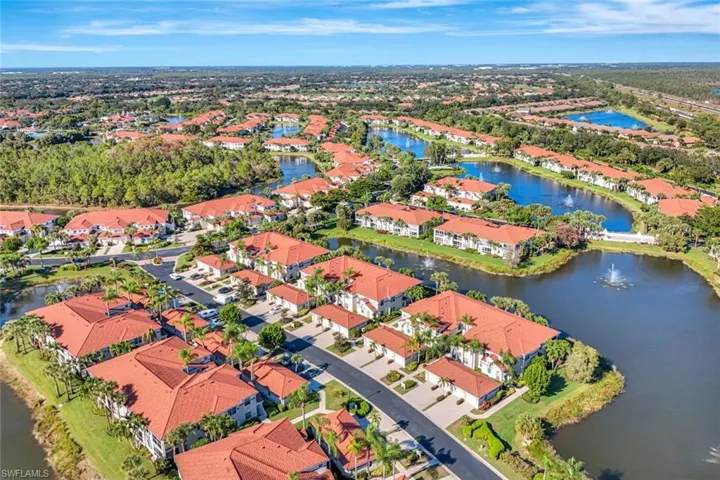 Aerial perspective of suburban area with a nearby body of water