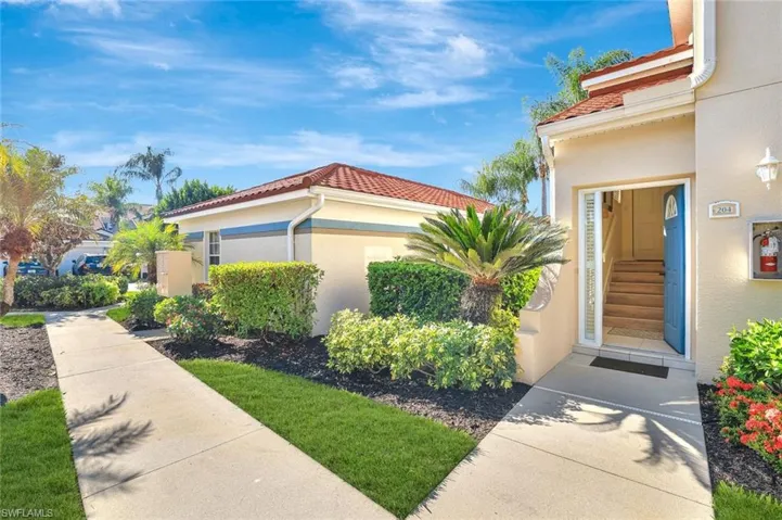 Entrance to property featuring stucco siding
