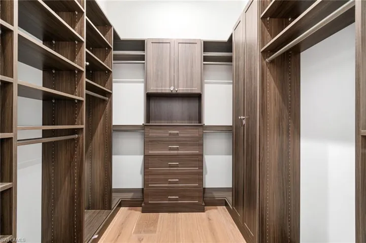 Walk in closet featuring light hardwood / wood-style floors