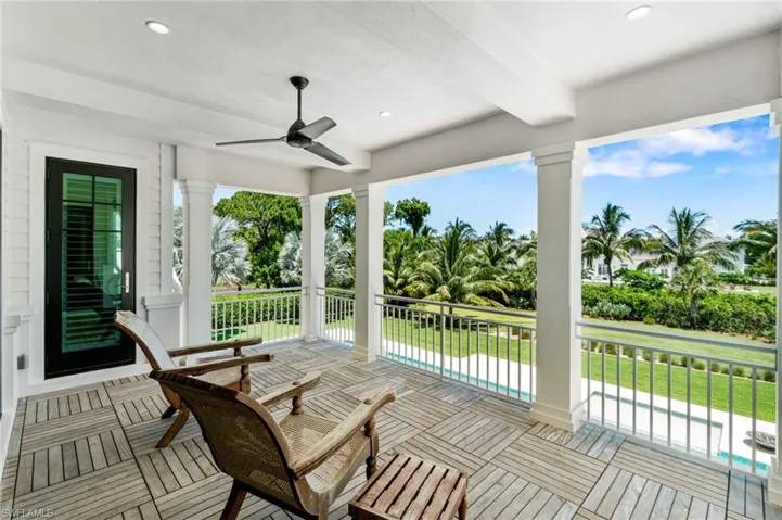 Deck featuring a yard and ceiling fan
