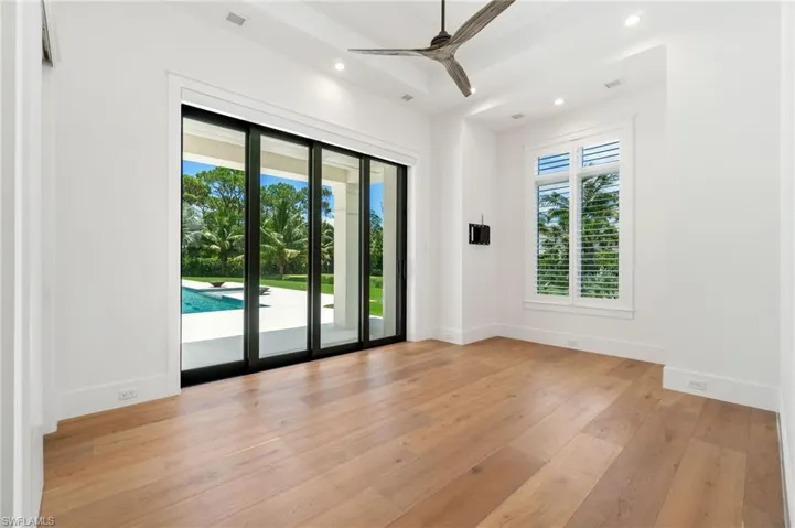 Spare room featuring light wood-type flooring and ceiling fan