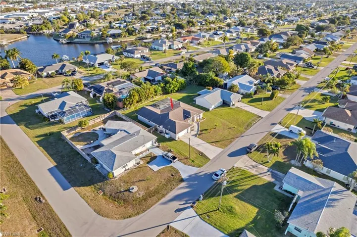 View of property location with nearby suburban area