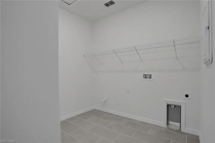 Laundry area with hookup for a washing machine and electric dryer hookup