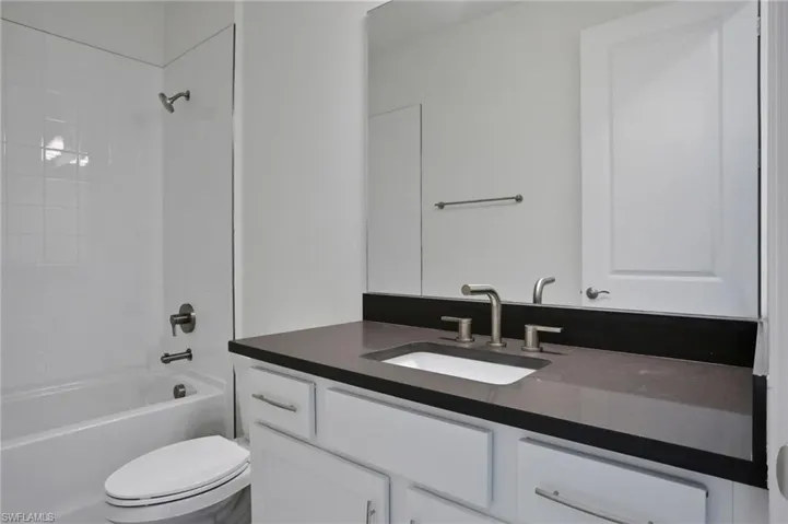 Full bathroom with  shower combination and vanity