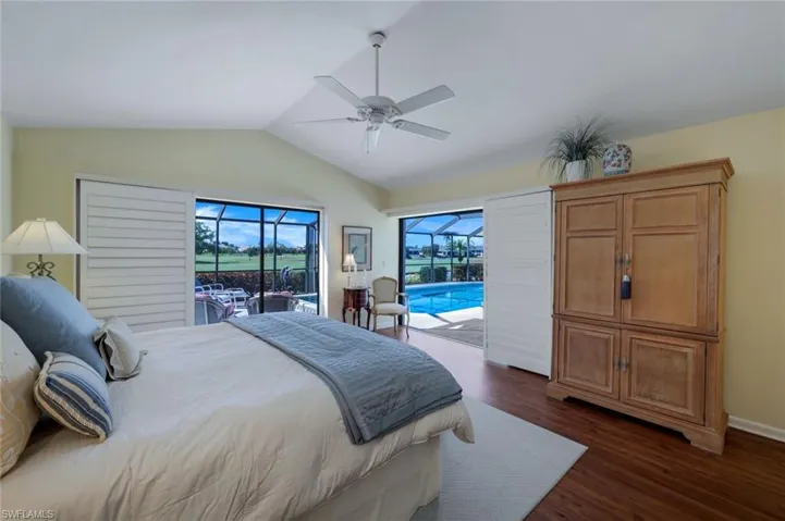 View II of the Primary Suite- Shown with a King Bed- Plantation Blinds