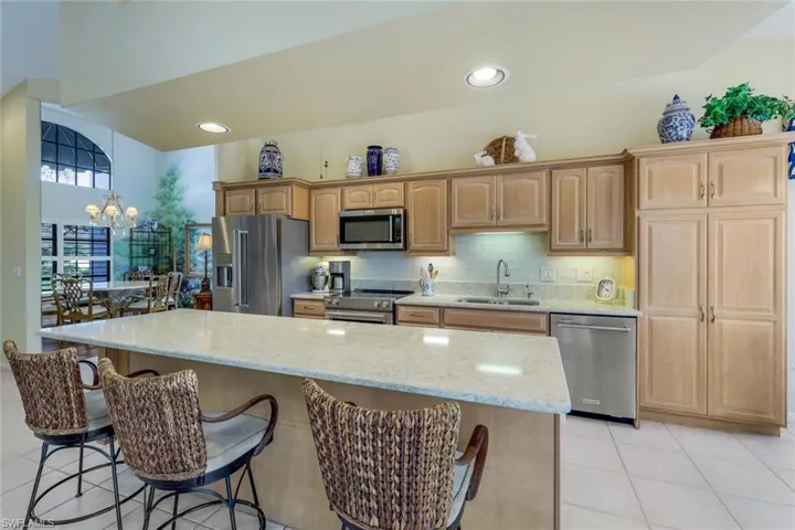 Light Wood Cabinetry- Island has Breakfast Bar