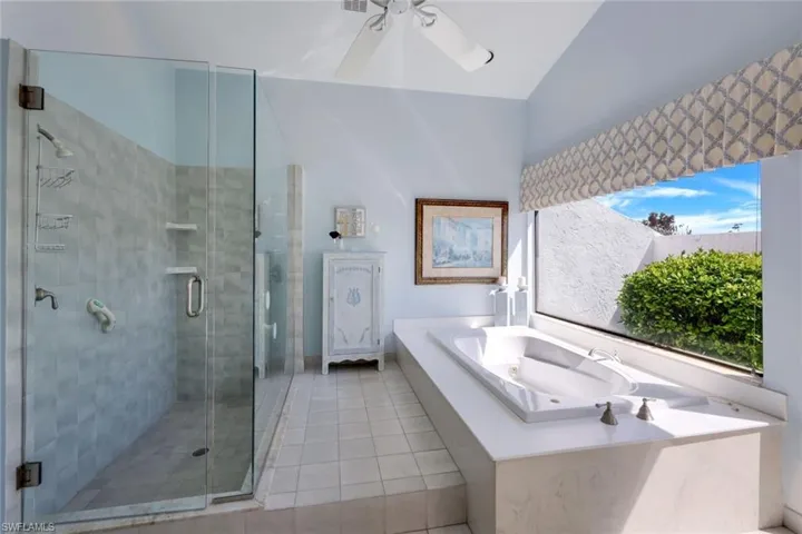 Primary Suite Easy Entry Jetted Tub, Separate Step In Glassed Shower, Tile Floor