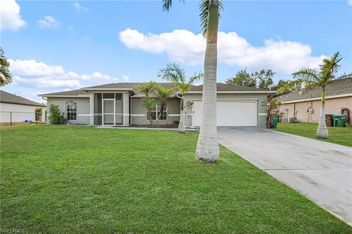 Ranch-style home with stucco siding, an attached garage, driveway, roof with shingles, and central AC