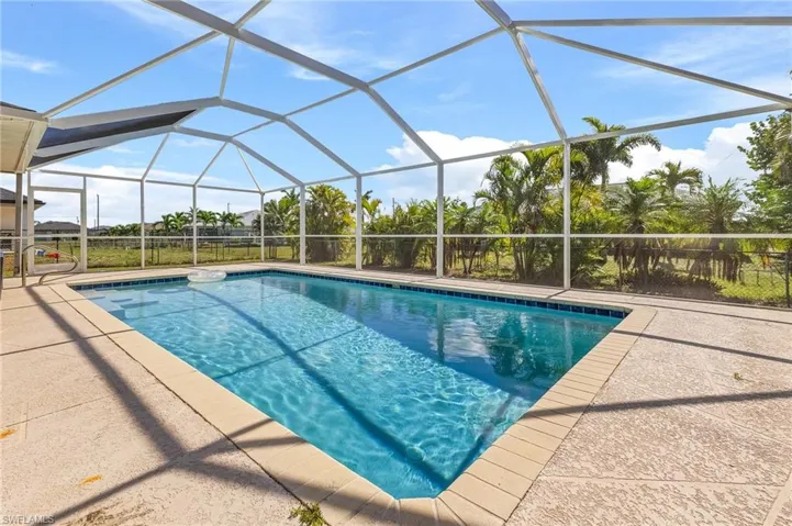 Outdoor pool featuring a patio area and a lanai
