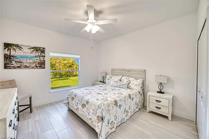 Bedroom featuring ceiling fan and a closet